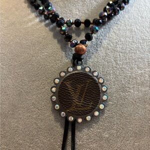 Elegant Black crystal Beaded Necklace with repurposed luxe label Pendant